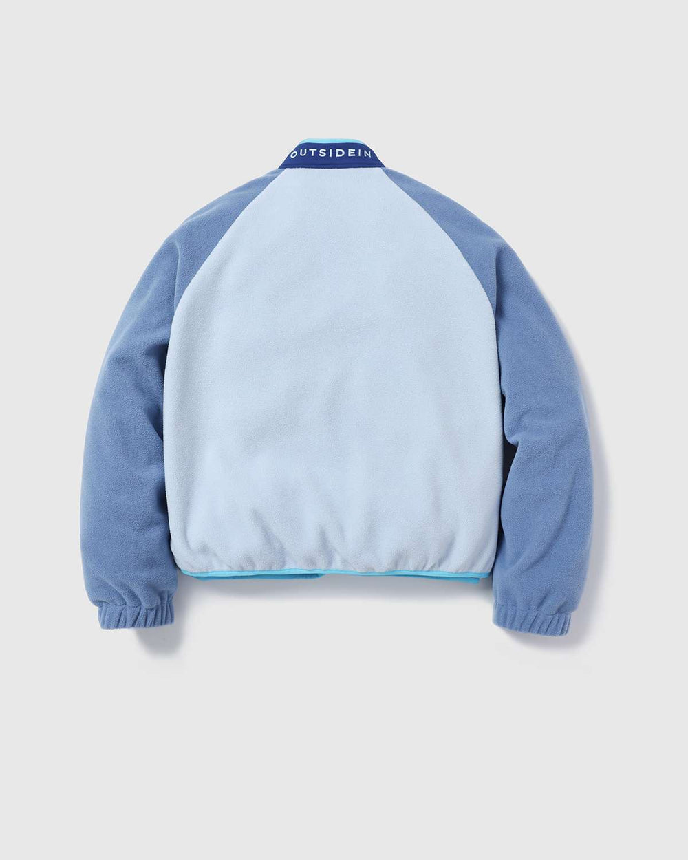 Back view of lightweight fleece jacket with light blue front panel and dark blue sleeves