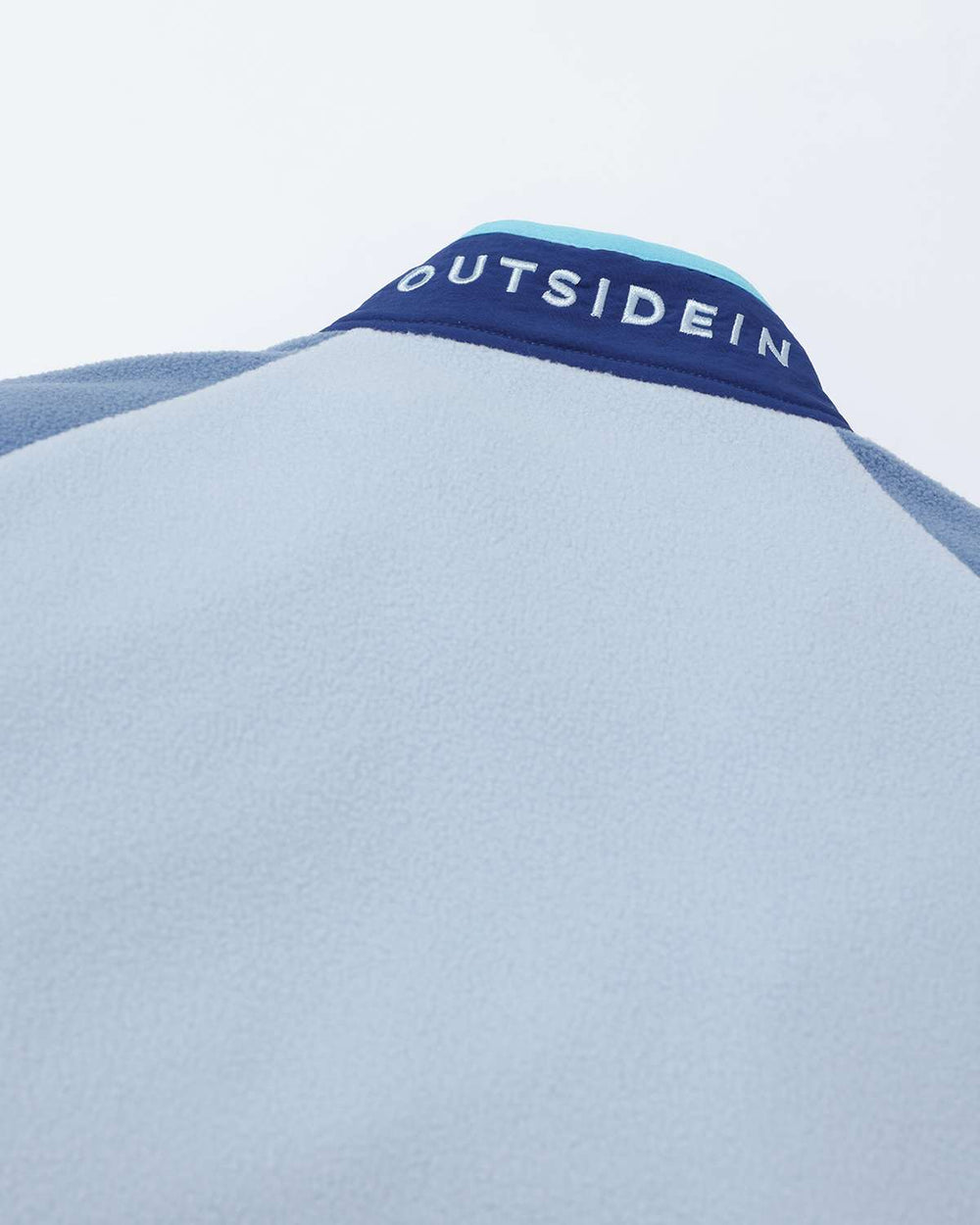 Lightweight fleece jacket back neck with OutsideIn logo strip across the collar