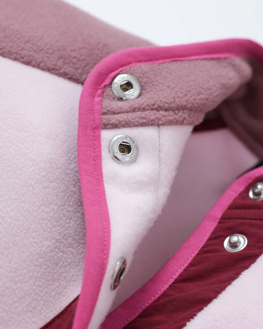 Fleece jacket inside collar with silver snap buttons and pink trim