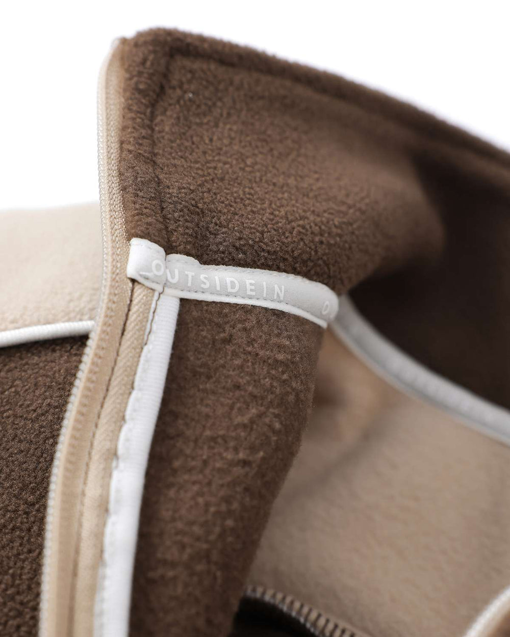 Brown fleece collar and zipper guard with OutsideIn printed elastic trim