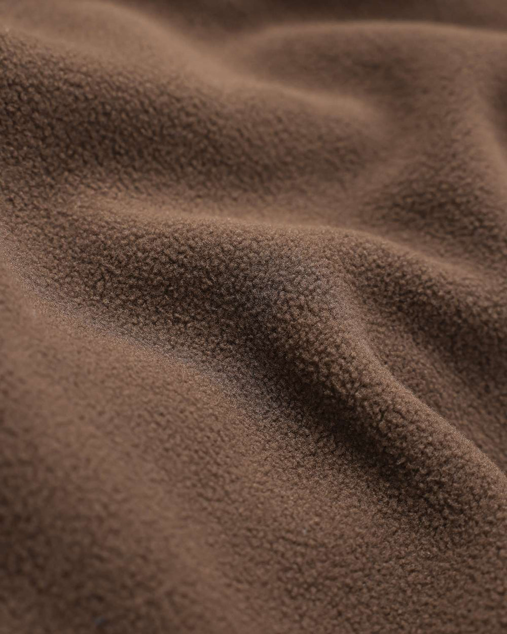 Close-up of brown fleece fabric texture