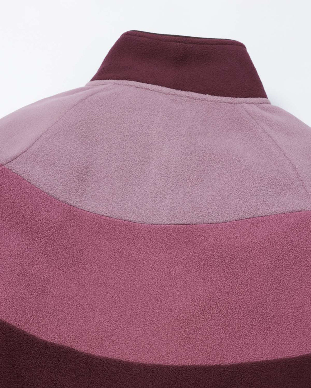 Two-tone fleece jacket collar close-up, stand collar in maroon with mauve panel