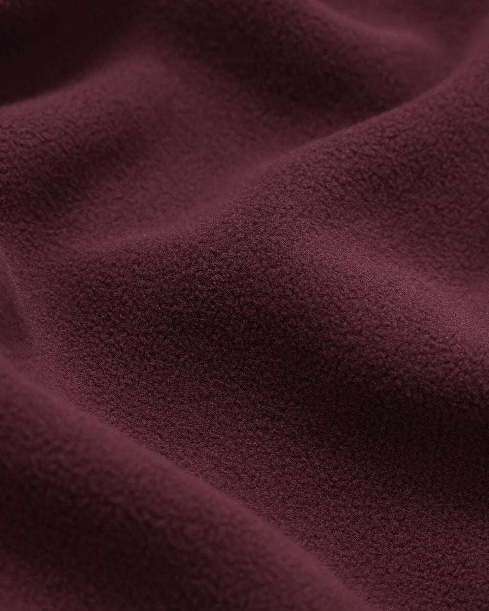 Maroon fleece fabric texture, soft plush knit-look material