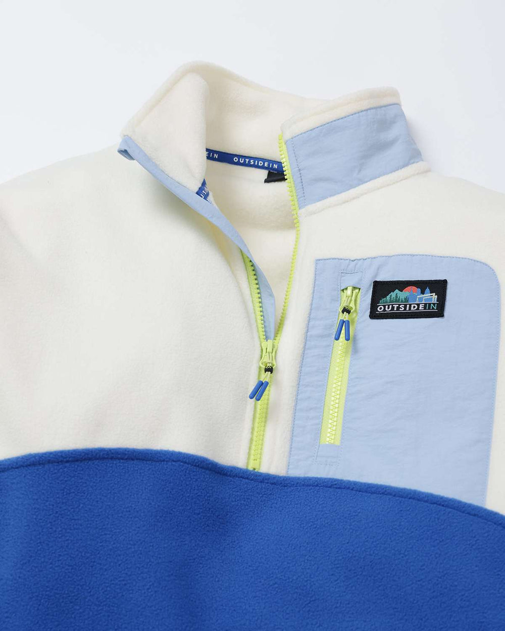 Microfleece half-zip jacket with cream sleeves, blue chest pocket, lime zipper tabs