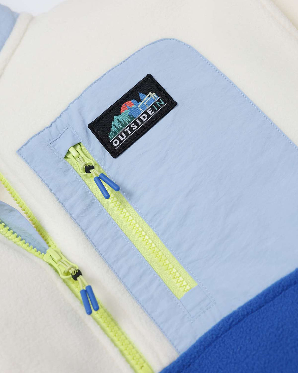 Microfleece jacket chest pocket with OutsideIn logo patch and lime zipper trim