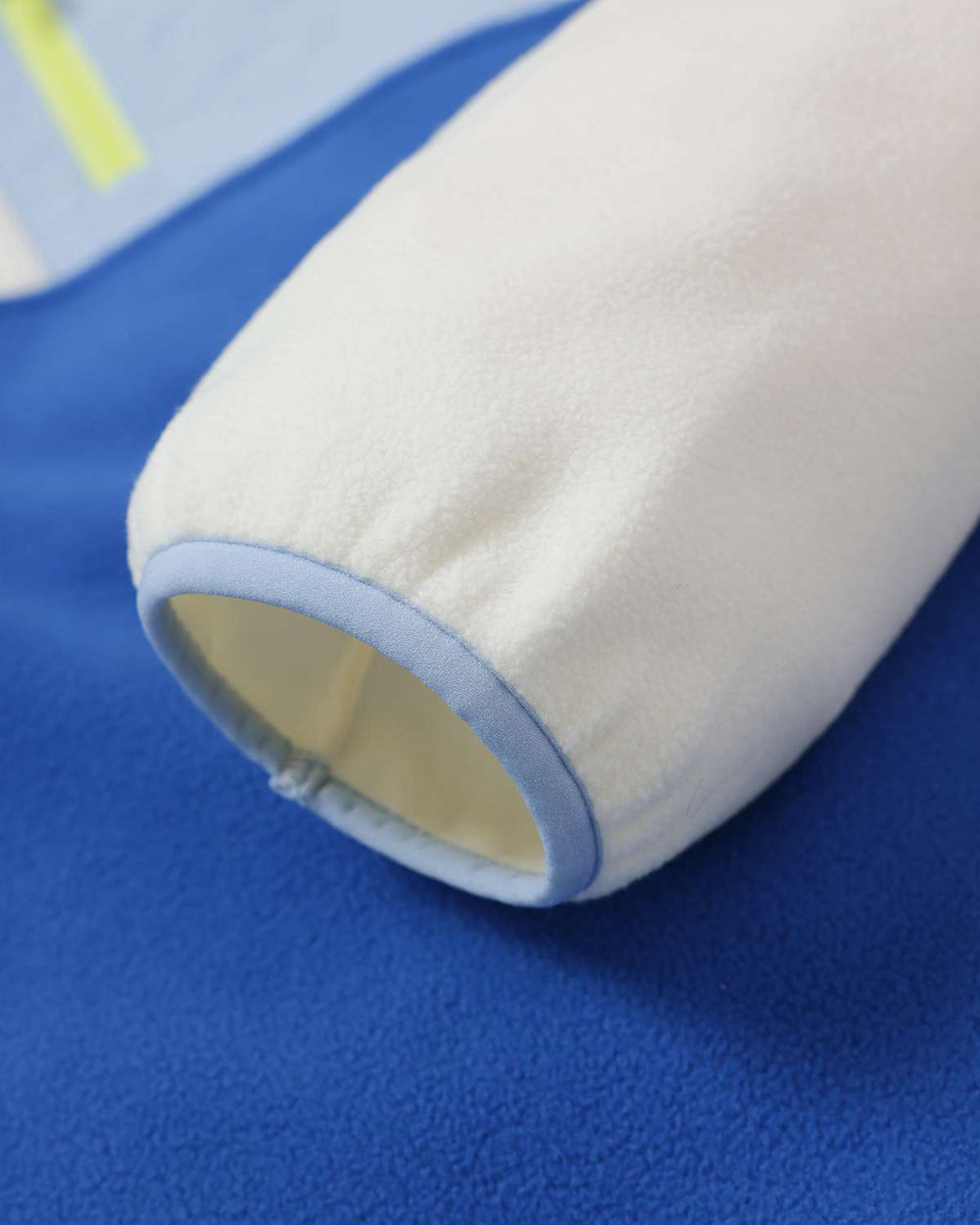 Microfleece jacket sleeve cuff in cream with blue body panel