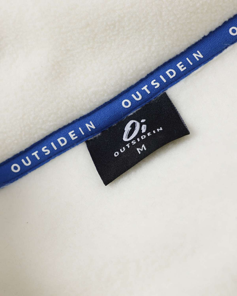 OutsideIn logo label on blue trim inside microfleece collar