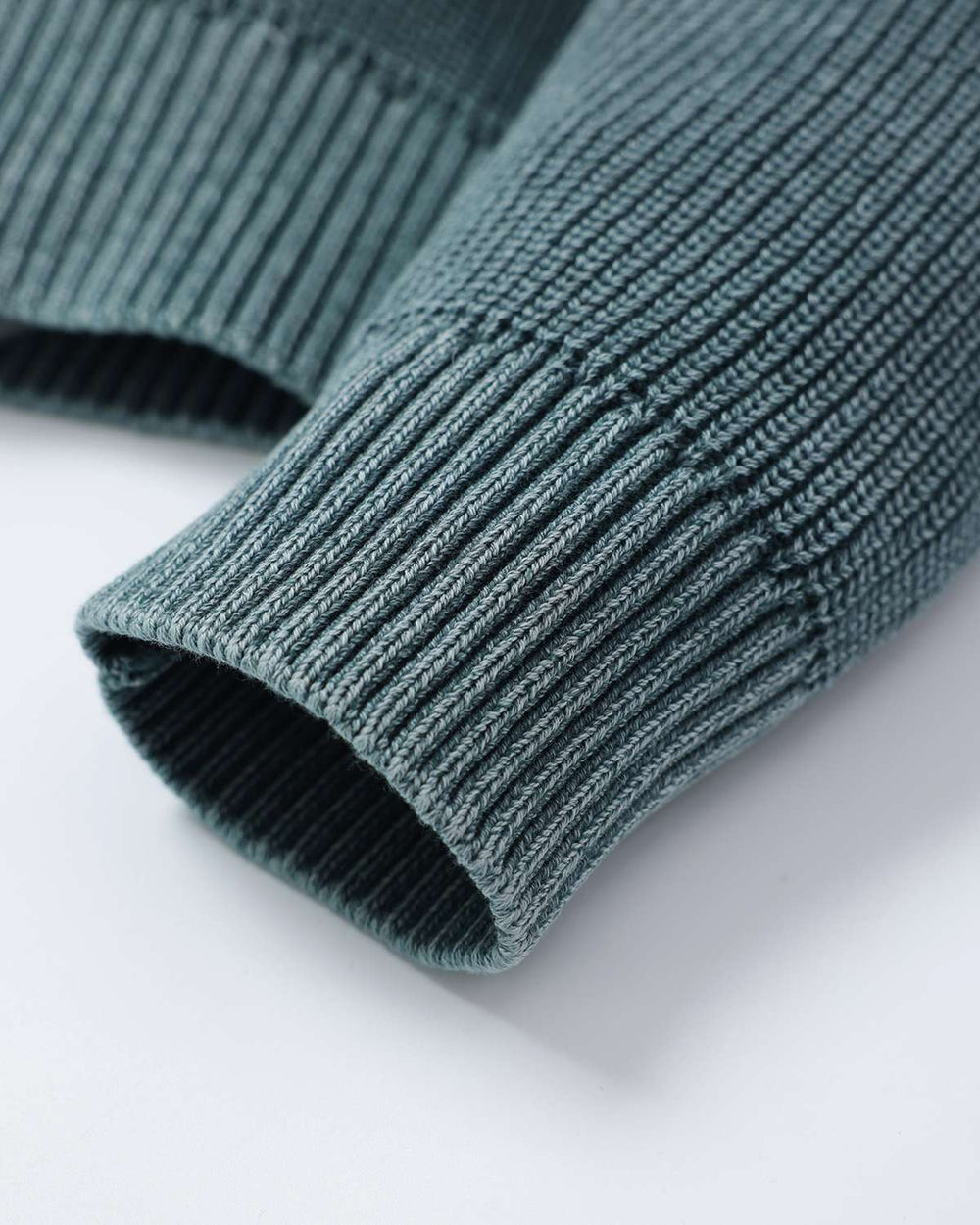 Fern green rib knit sweater cuff with ribbed knit hem opening