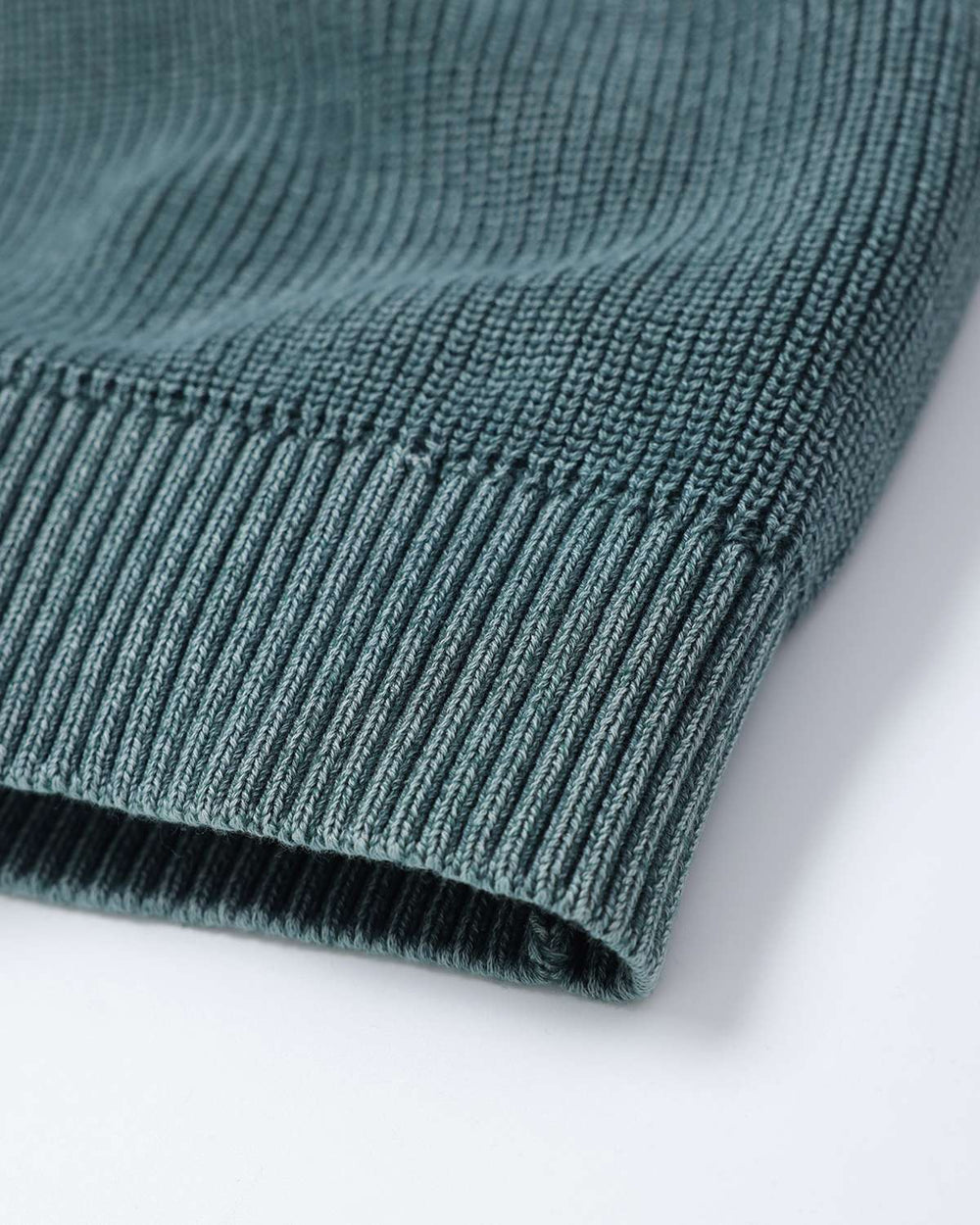 Fern green rib knit sweater hem and cuff, ribbing texture close-up