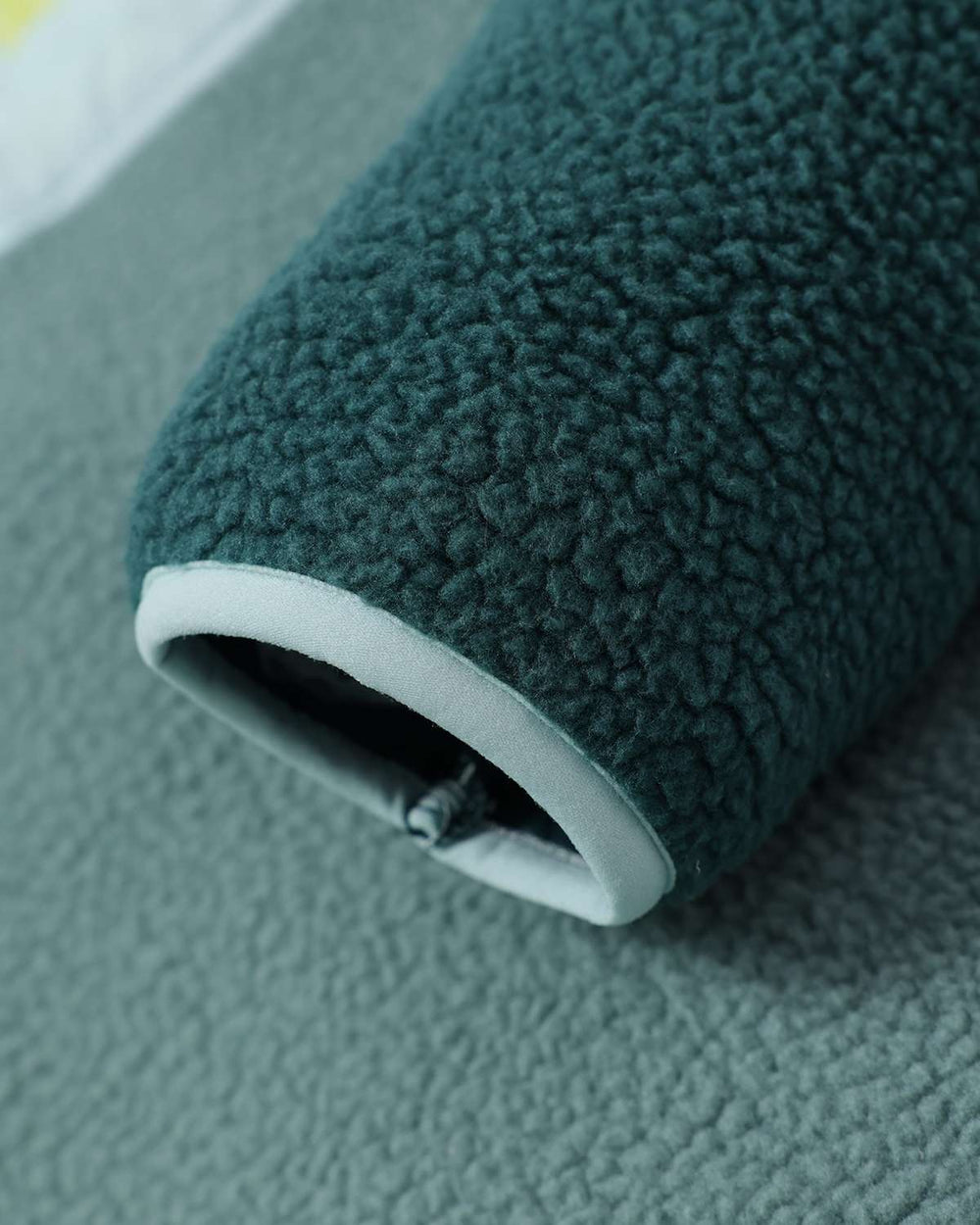 Evergreen borg fleece sleeve cuff with stretchy rib and white inner trim