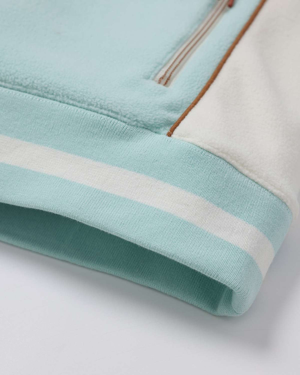 Ice blue sports fleece jacket hem and ribbed cuff detail, striped trim