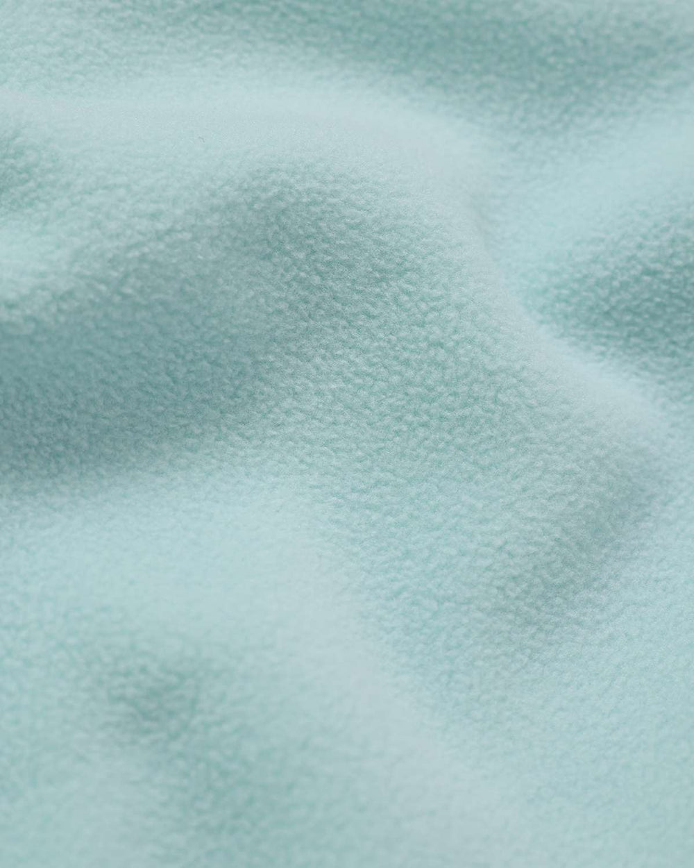 Soft ice blue fleece fabric texture, plush surface
