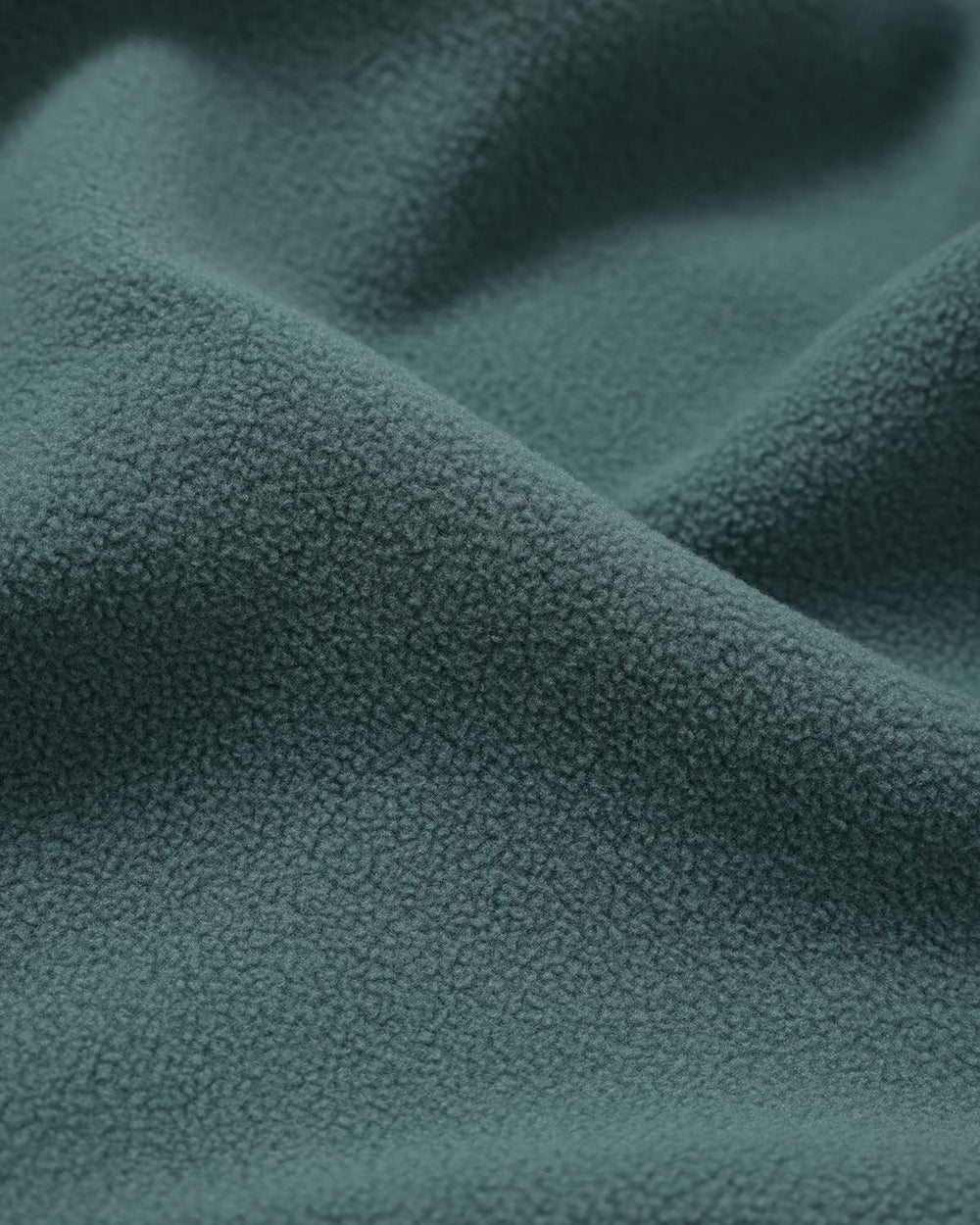 Teal wave-textured fleece fabric with soft curly pile