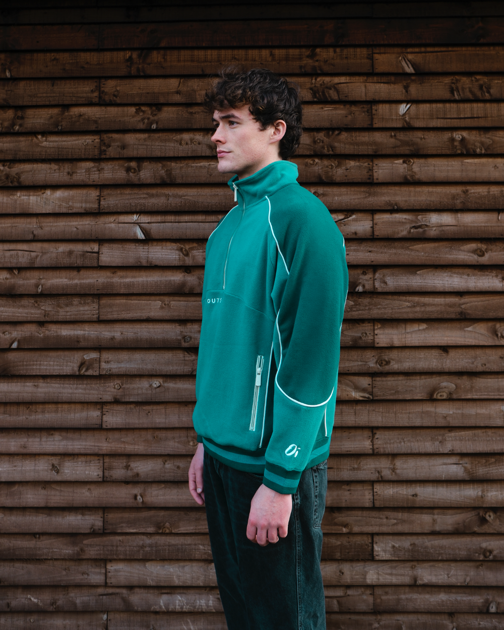 model wearing pine green unisex sports fleece