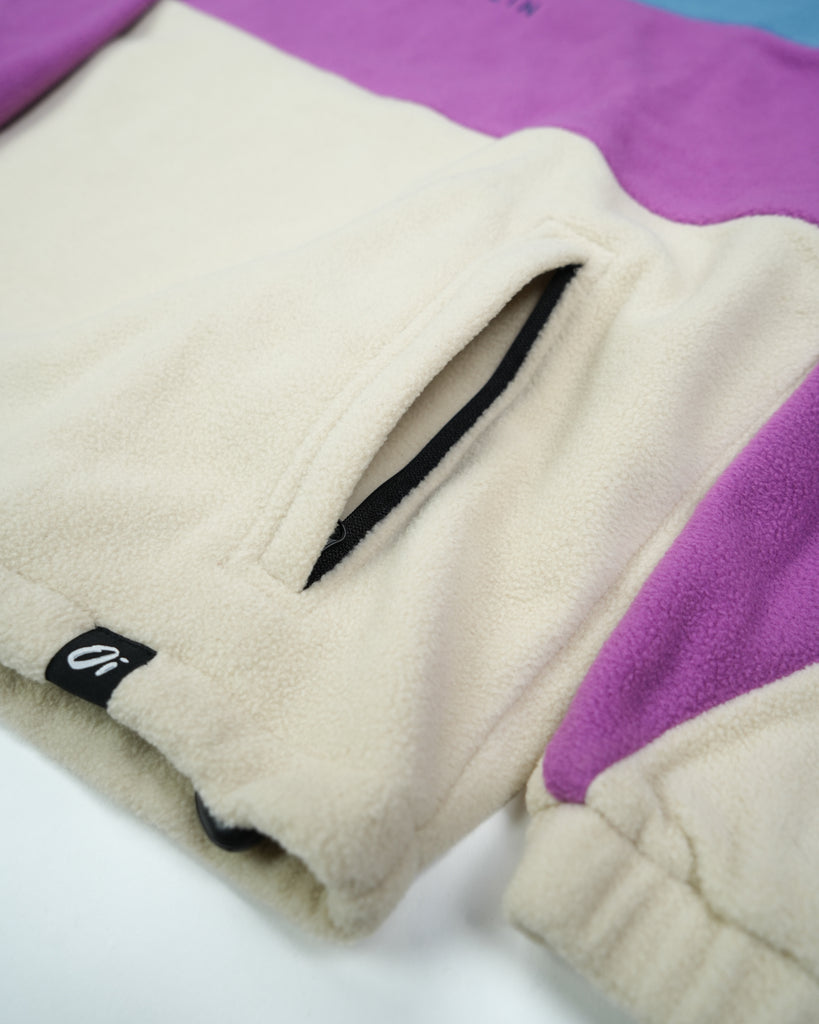 Unisex Aqua Purple Band Fleece with panelled design, toggle fastening, and cosy pockets