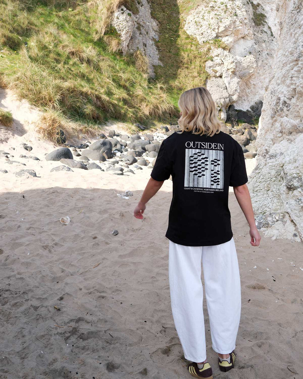Model wearing an OutsideIn Black Abstract Causeway T shirt