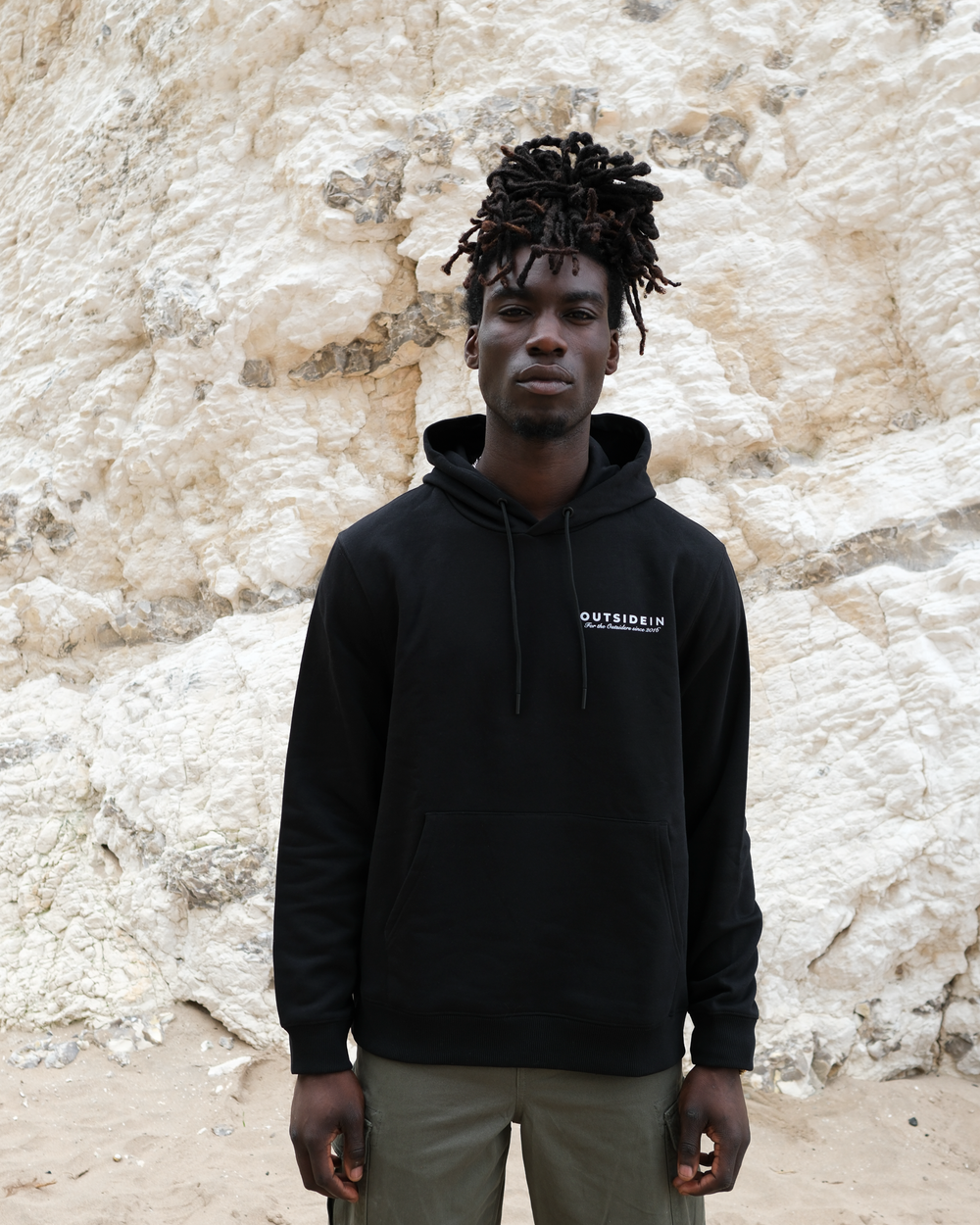 OutsideIn Black hoodie with core logo, lifestyle photo