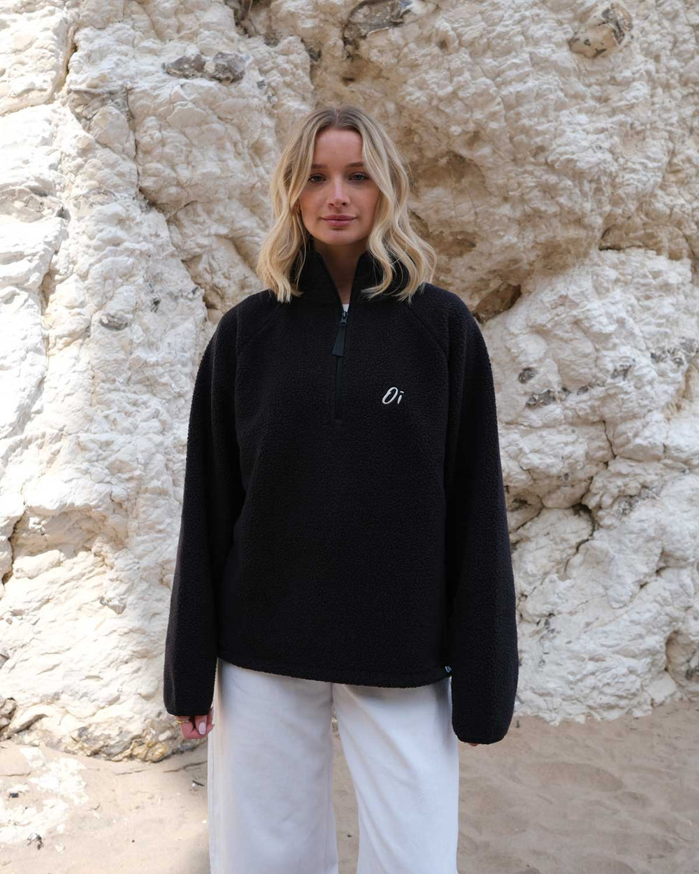 Model wearing OutsideIn Black Teddy Quarter Zip Fleece