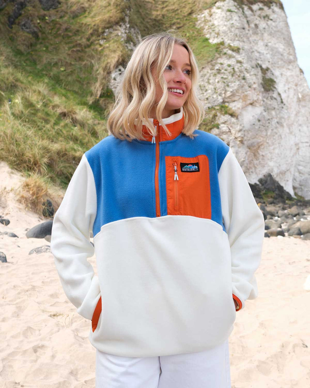 Model wearing Blue & Orange Signature Pocket Fleece