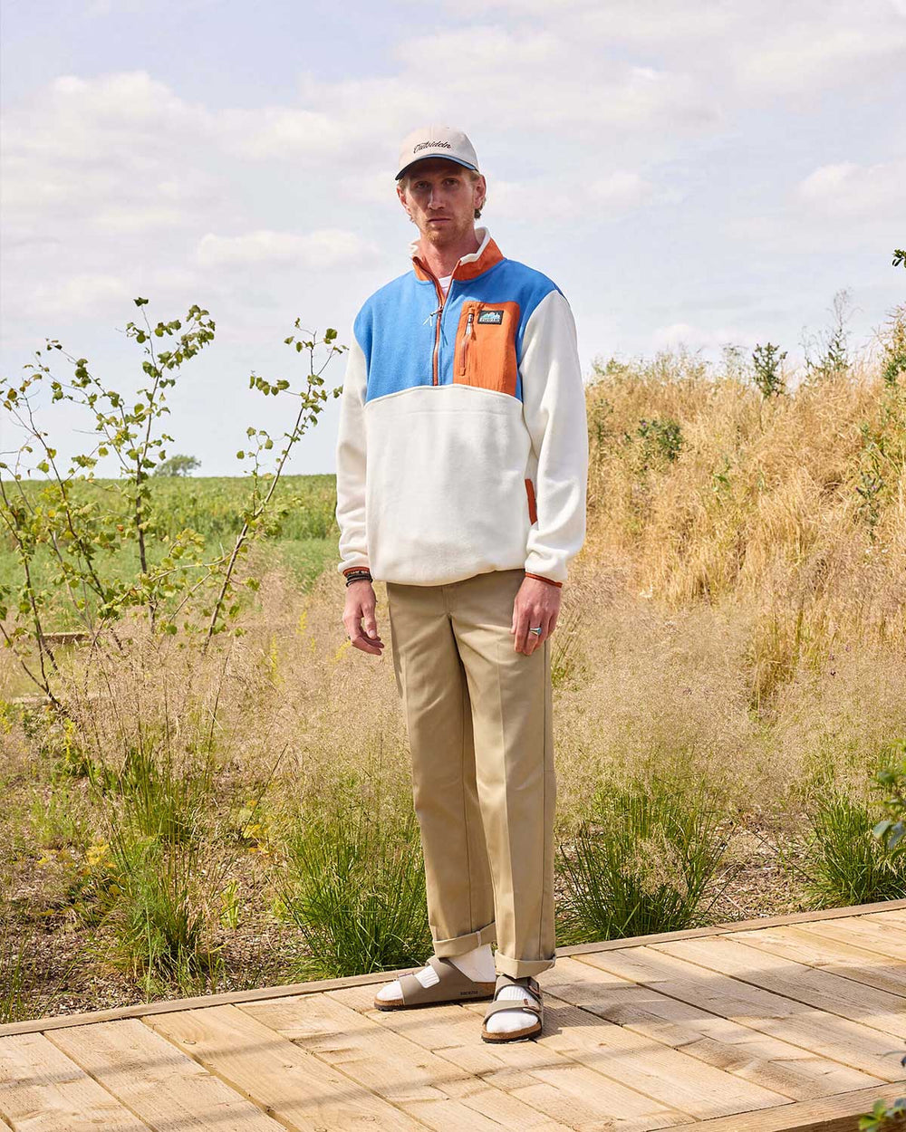 Model wearing OI Blue & Orange Signature Pocket Fleece