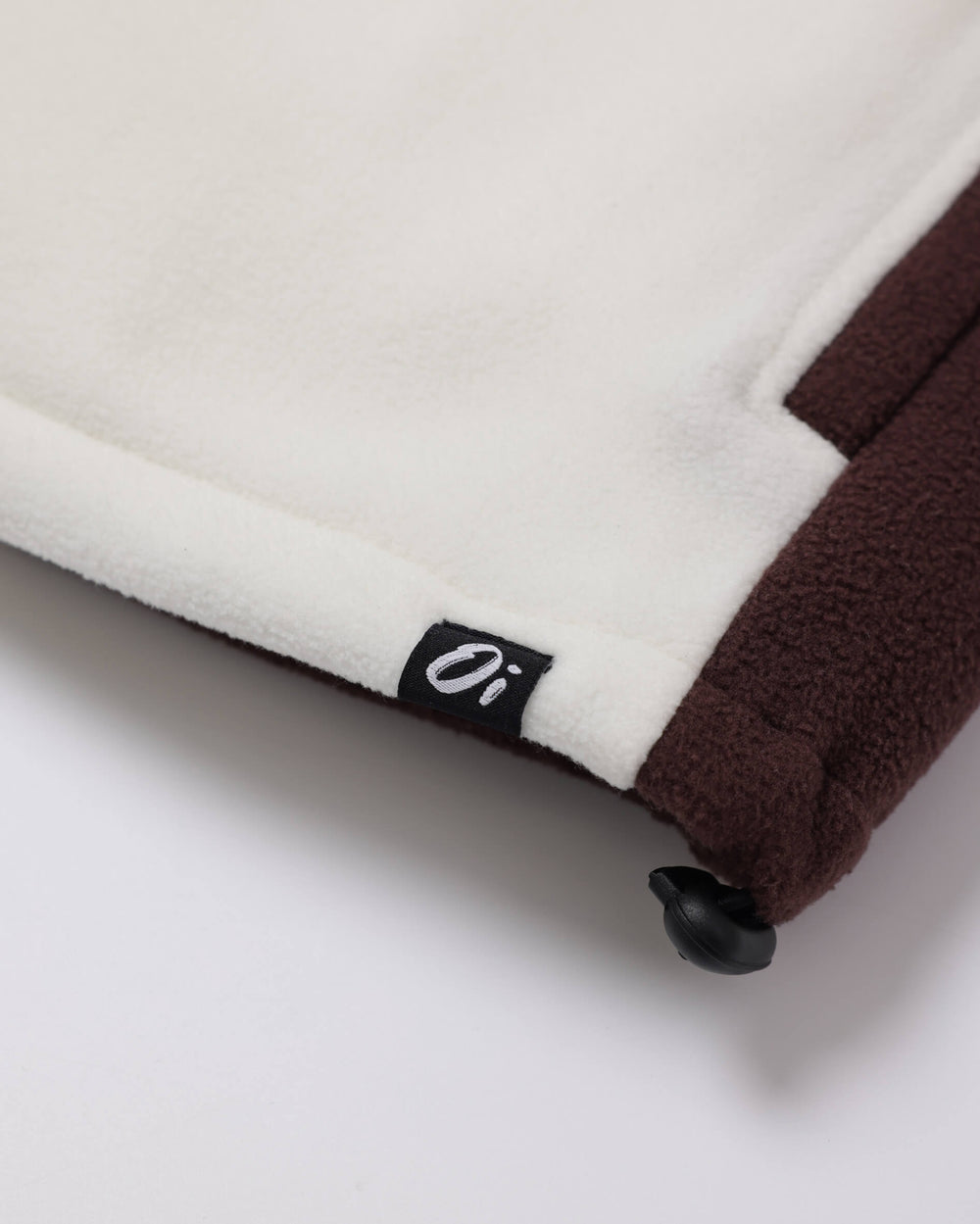 Close-up of a OutsideIn Brown Cream Canyon Fleece with OutsideIn label