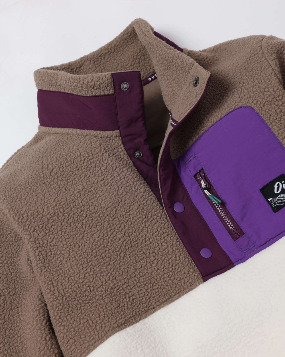 Borg fleece button-up with brown texture, purple side panels, zippered chest pocket