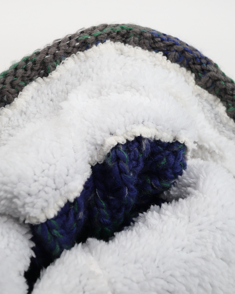 Pom hat in Wild Atlantic colour featuring soft faux shearling base lining and 100% acrylic yarn