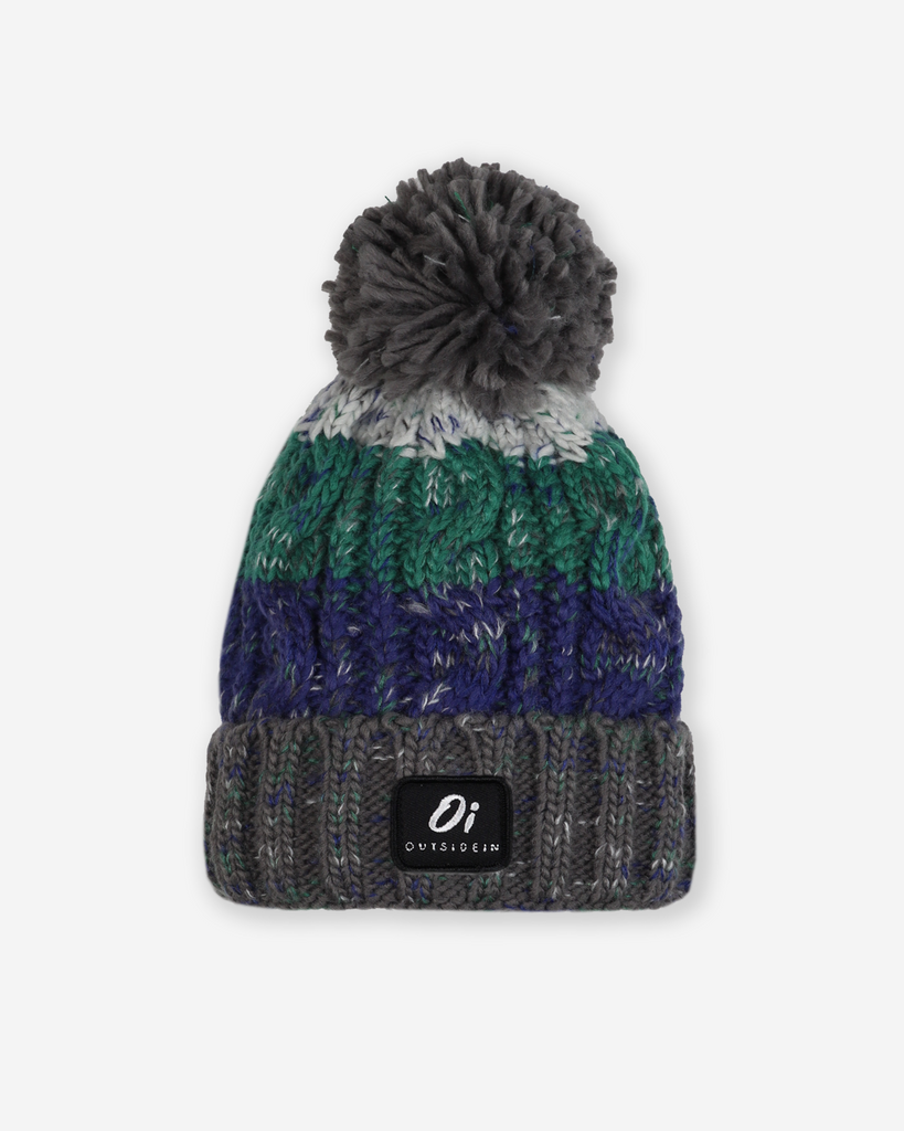 Pom hat in Wild Atlantic colour featuring soft faux shearling base lining and 100% acrylic yarn