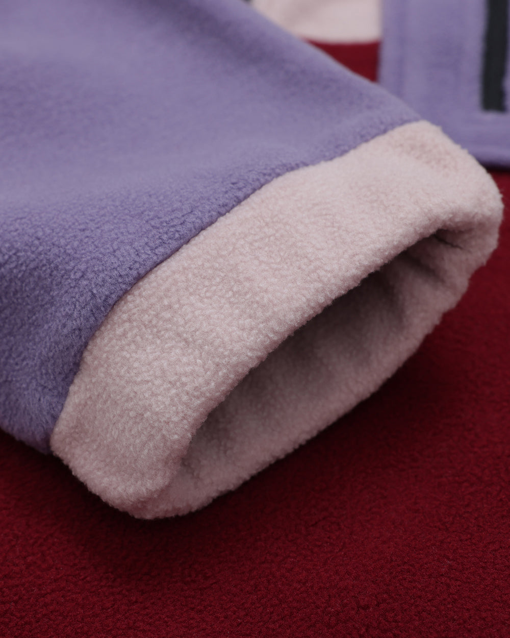 Close-up of Wild Mulberry OutsideIn fleece, cozy 1/2 zip fleece