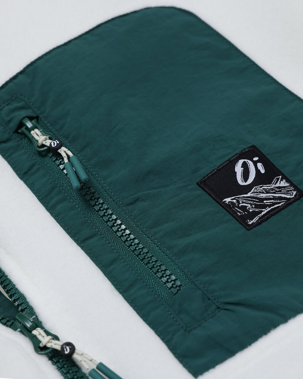 Close-up of OutsideIn Cream & Pine Pocket Fleece
