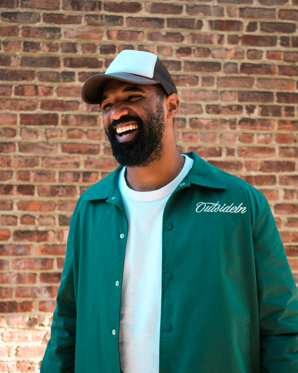 Model wearing Outside In Pine coach jacket