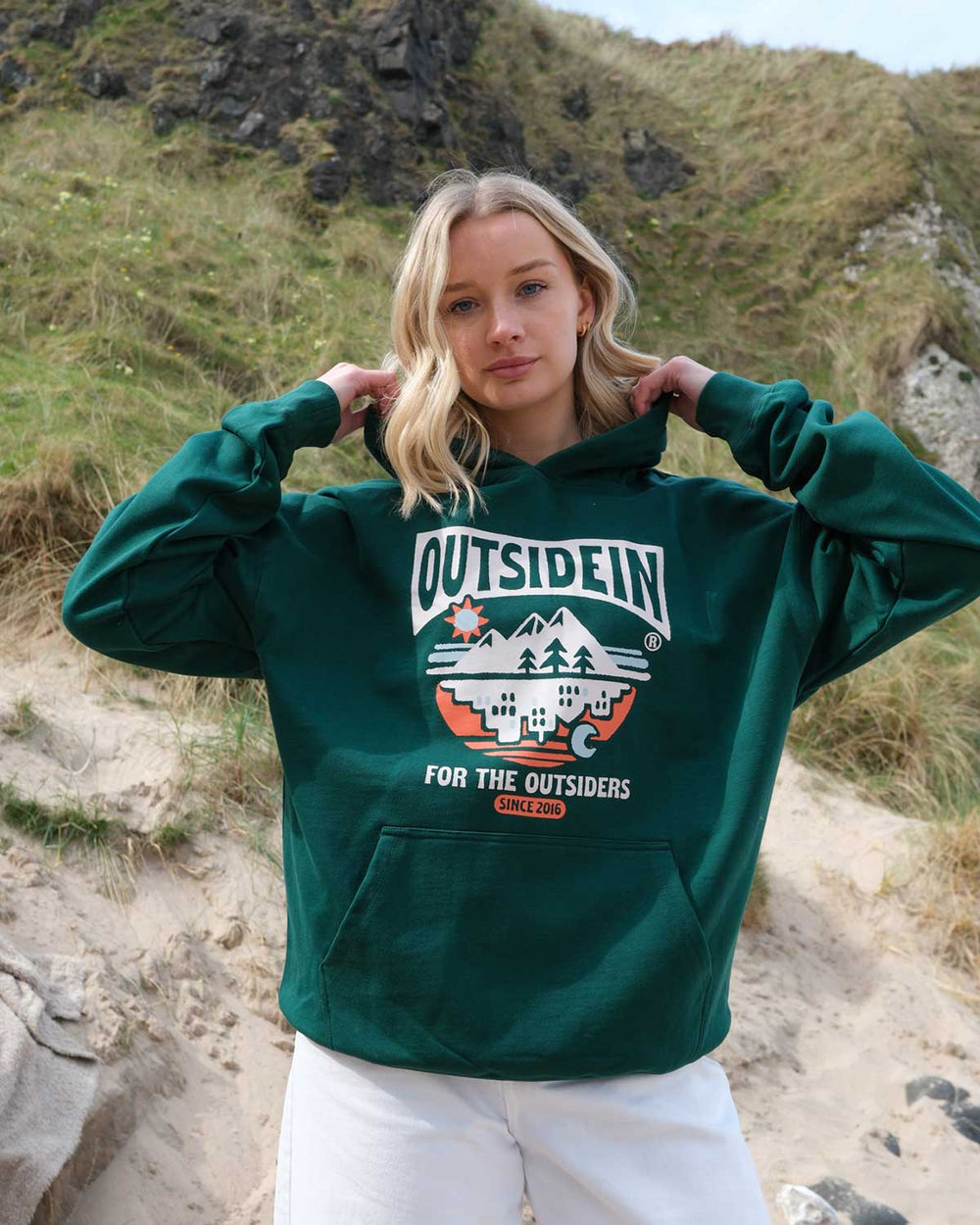 Model wearing OutsideIn For The Outsiders Hoodie 