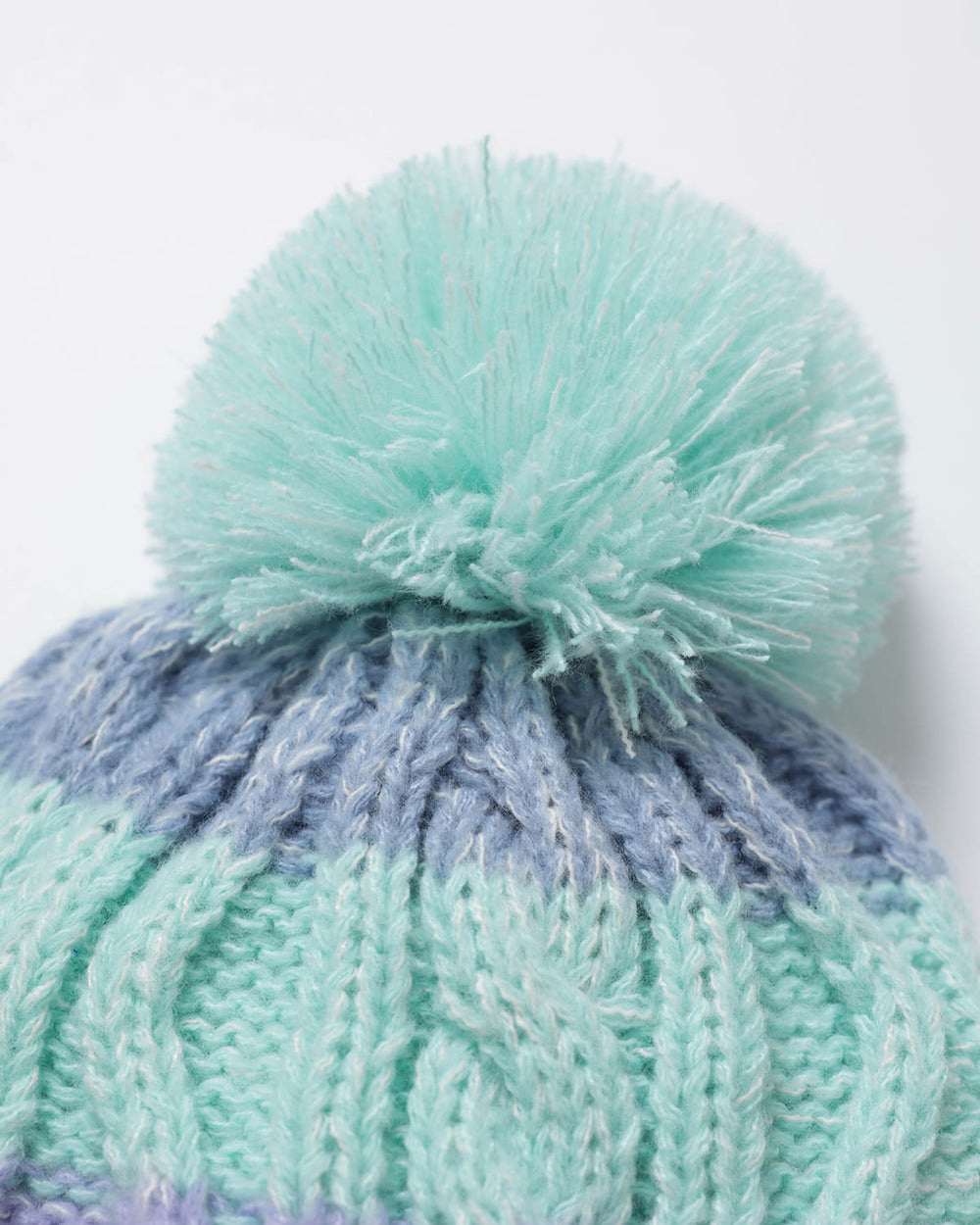 Close up of OutsideIn Pom Pom on hat