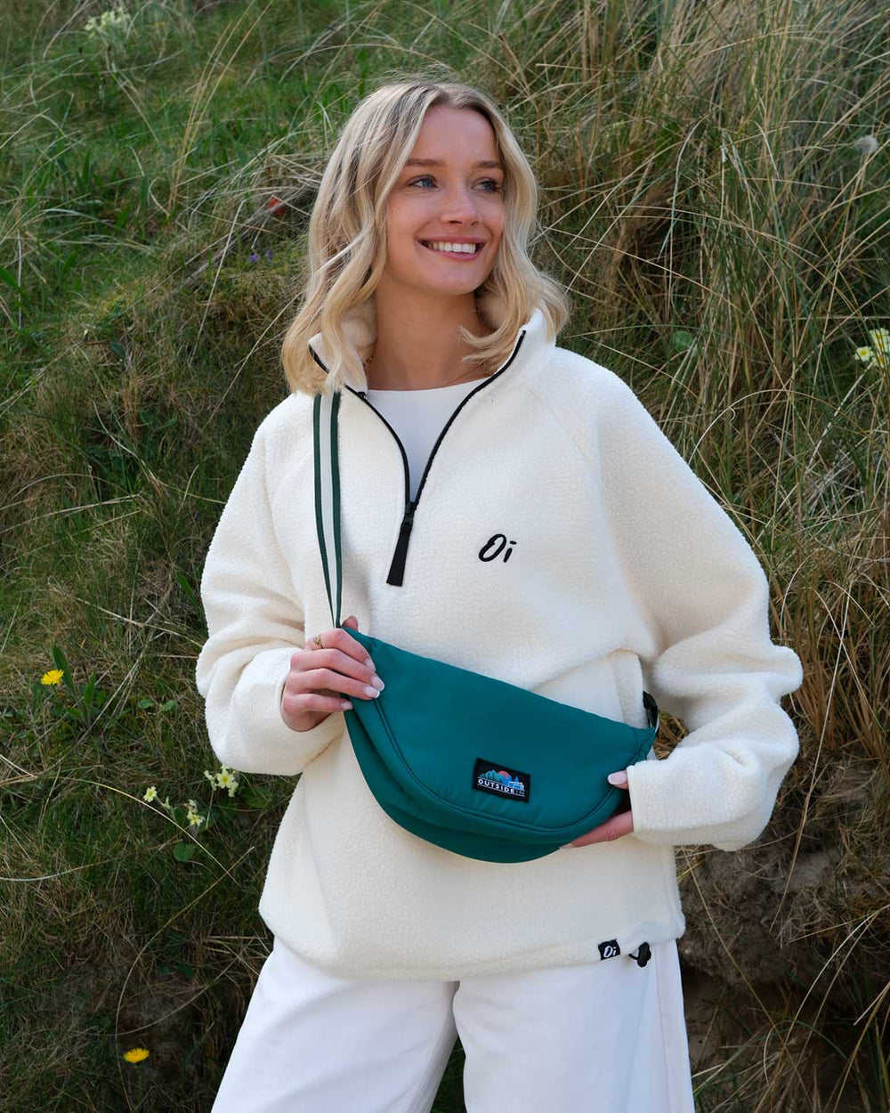 Model wearing OutsideIn Pine Wanderer Cross Body Bag