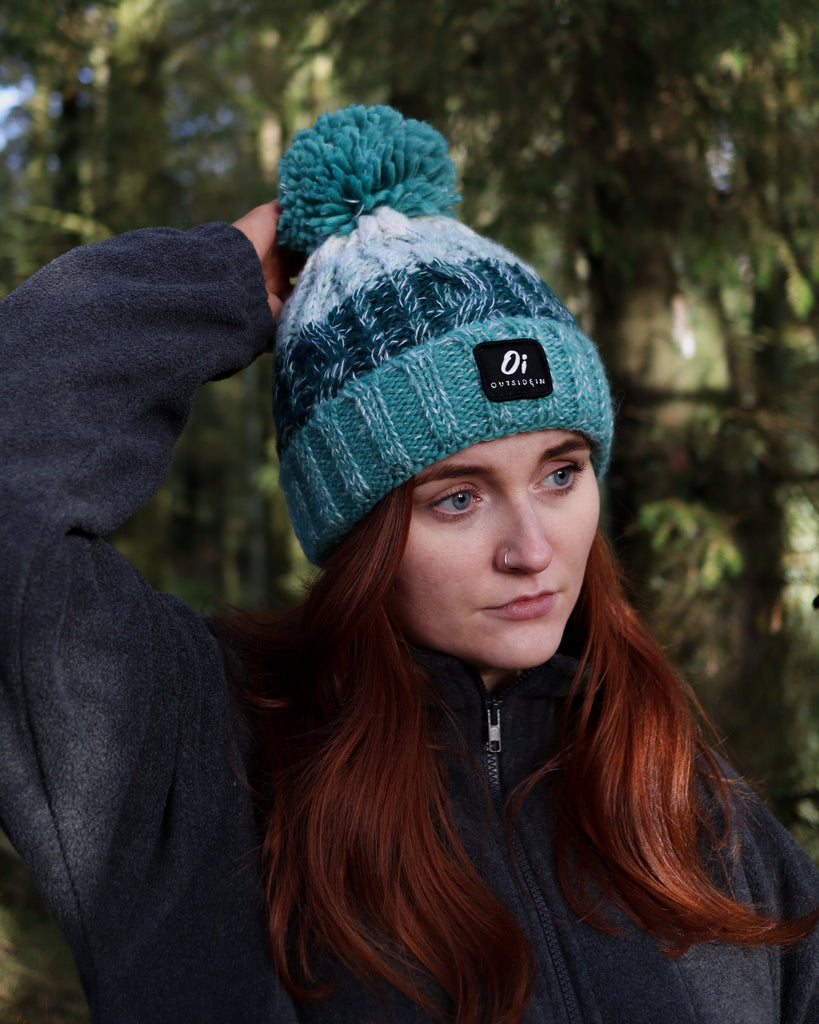 Sea Foam Pom hat with partial faux shearling lining and acrylic knit