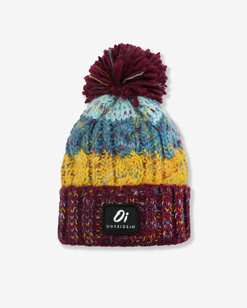 Kids’ Book Club Pom hat with warm fleece base and colourful patterned top