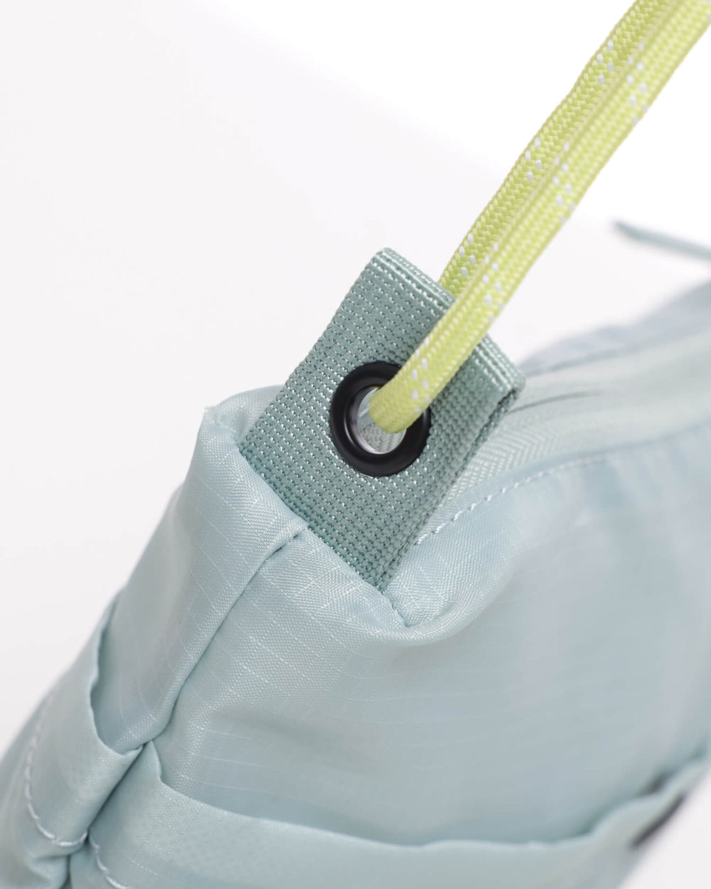 Close up of OutsideIn Light Green Lightweight Shoulder Pouch