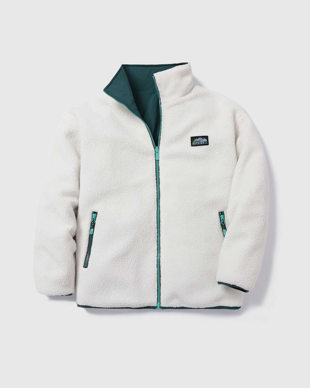 Reversible fleece jacket in white with turquoise zipper and side pockets