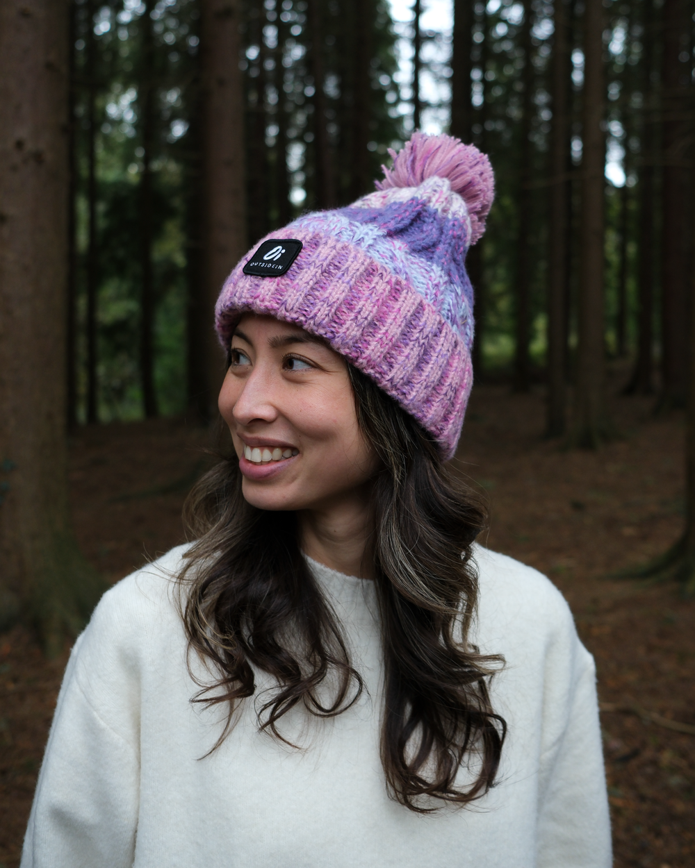 Model wearing OutsideIn Candy Cloud Cotton Pom Pom