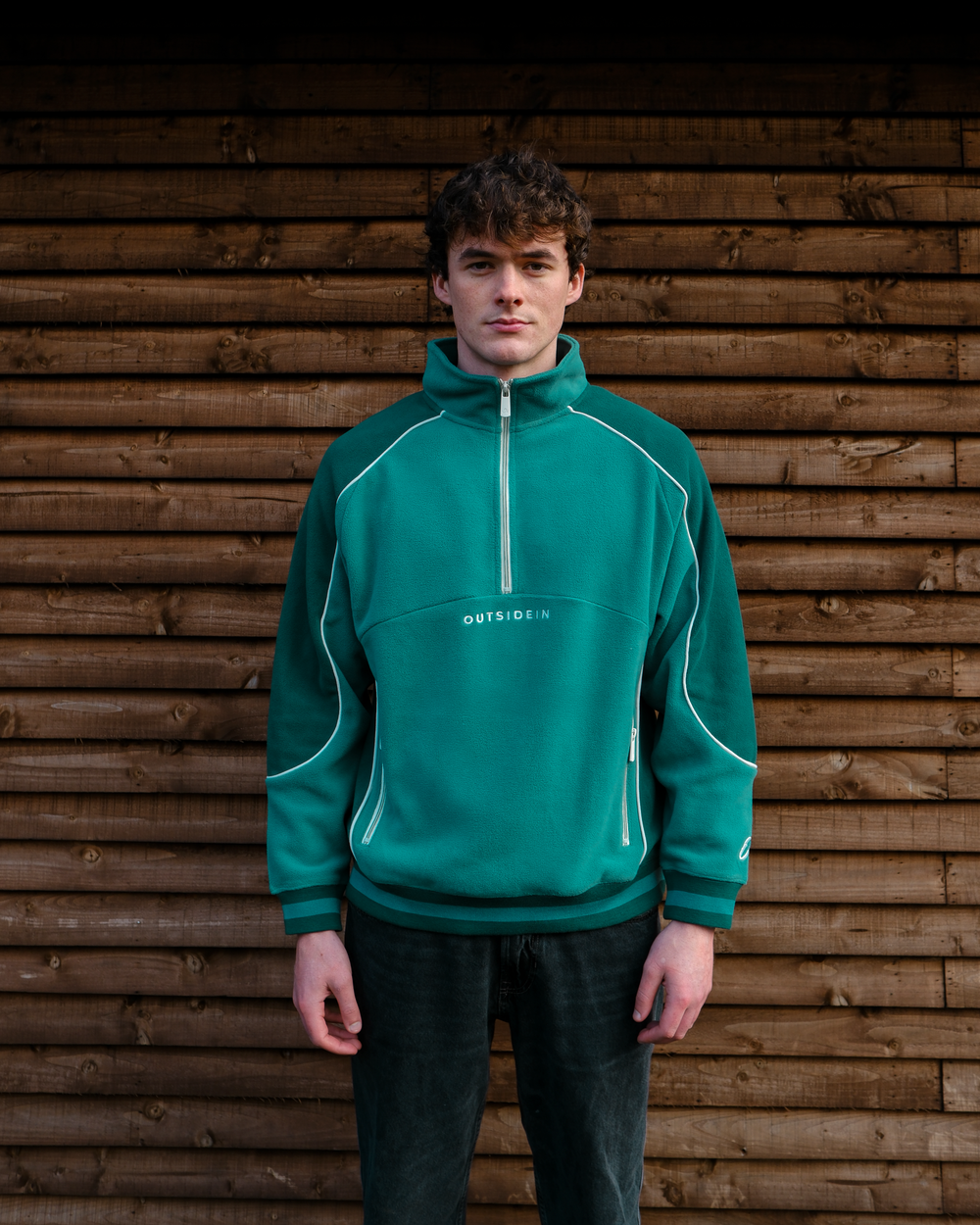 Model wearing OutsideIn Pine Sports Fleece