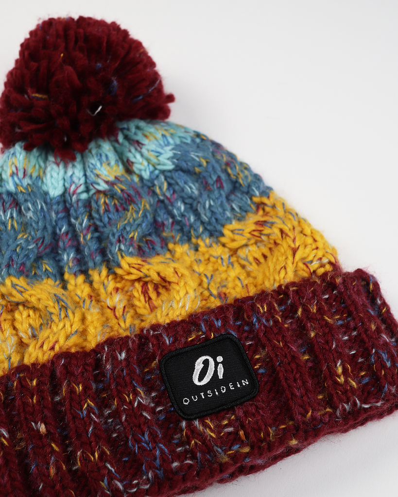 Book Club Pom hat with partial faux shearling lining and acrylic knit