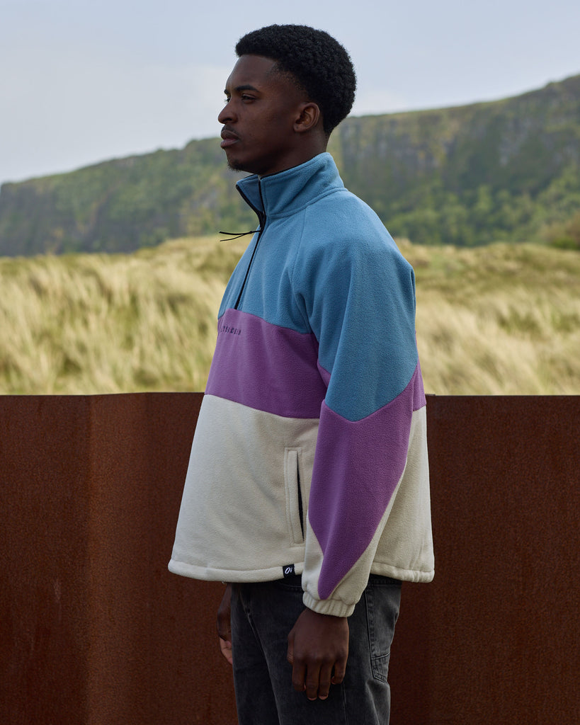 Unisex Aqua Purple Band Fleece with panelled design, toggle fastening, and cosy pockets