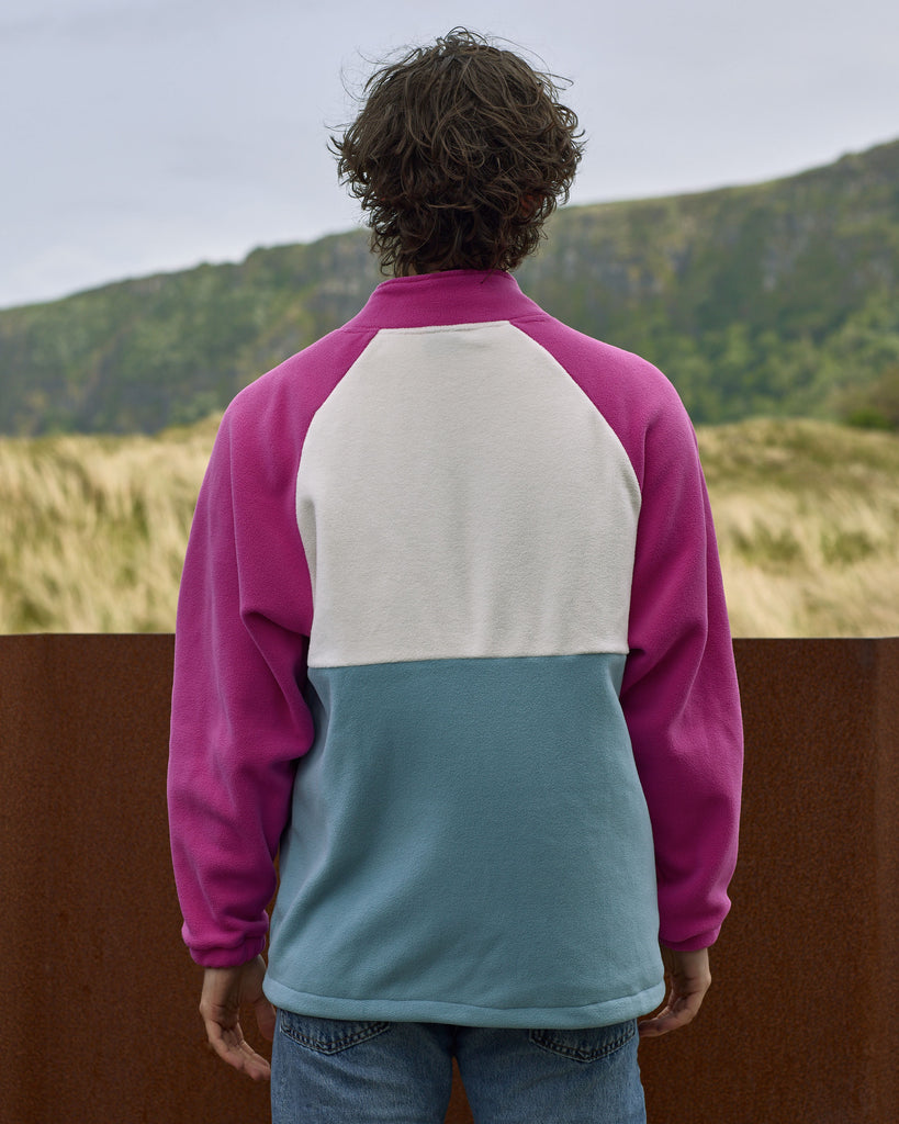 Unisex magenta cream fleece with quarter zip, front pocket and toggle detail