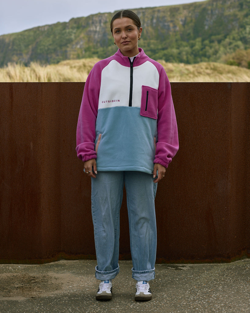 Unisex magenta cream fleece with quarter zip, front pocket and toggle detail