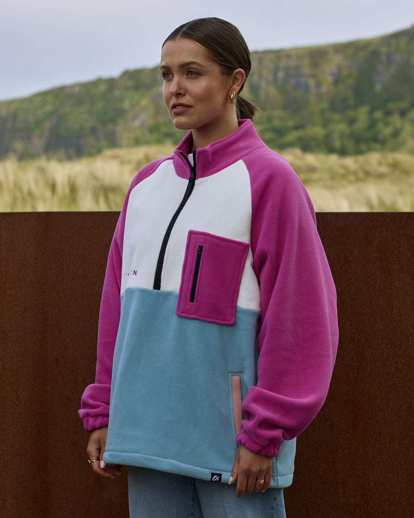 Unisex magenta cream fleece with quarter zip, front pocket and toggle detail