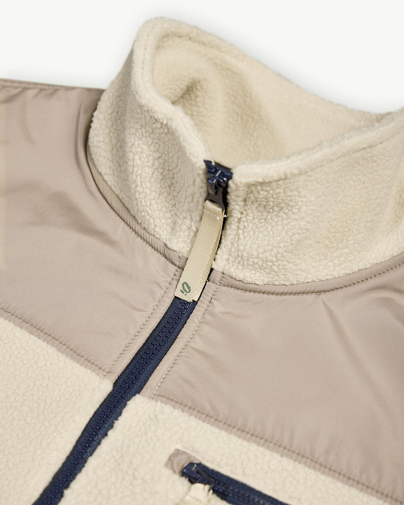 Oatmilk borg fleece with full zip, nylon contrast panels, and zip pockets