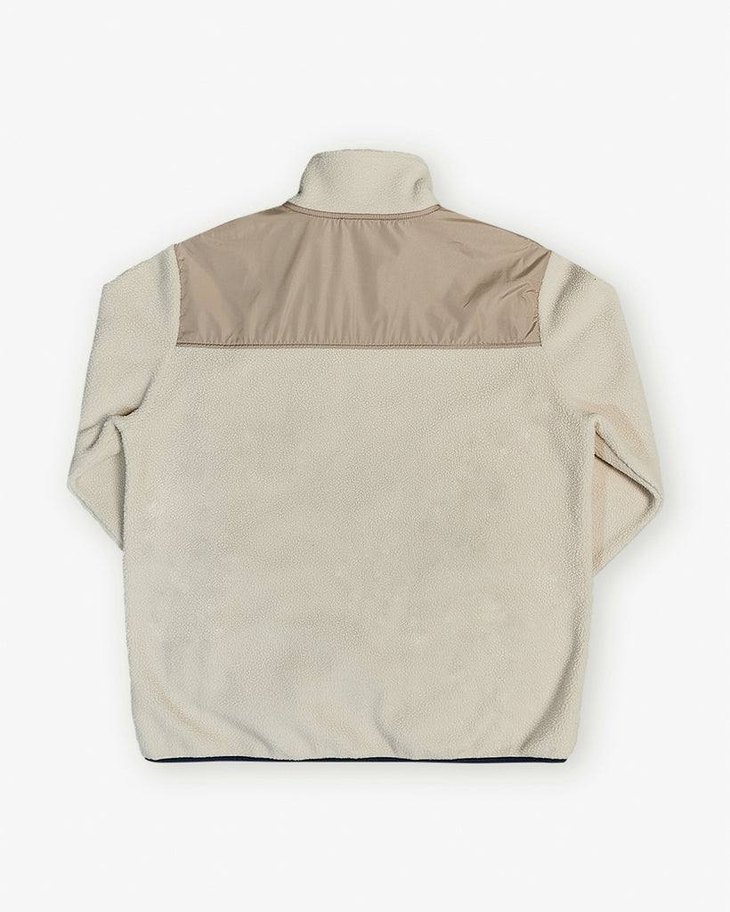 Oatmilk borg fleece with full zip, nylon contrast panels, and zip pockets