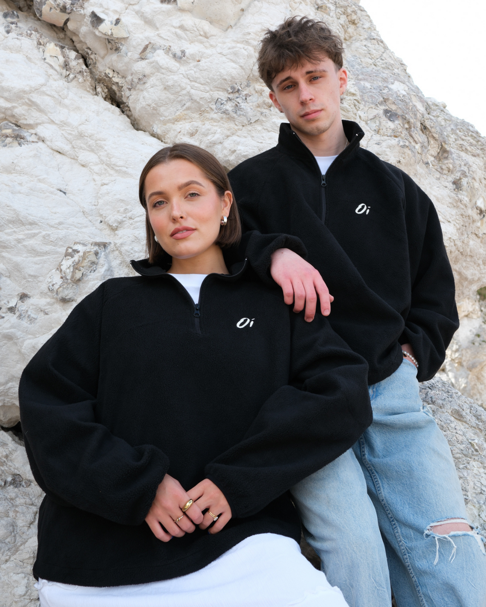 Models wearing OutsideIn Black Zip Essential Fleece