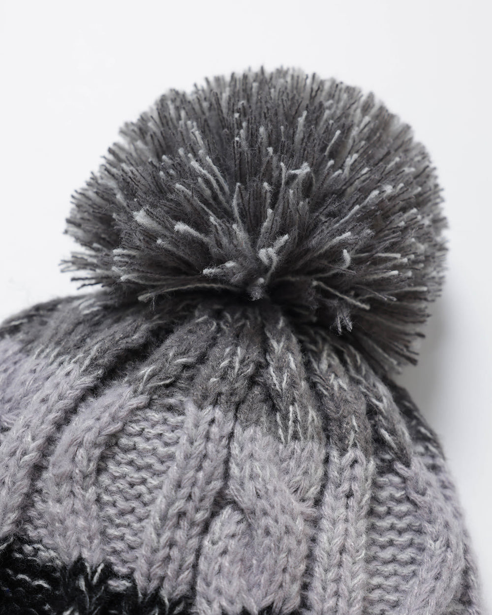 OutsideIn Grey and Black Charcoal Ridge close up of Pom
