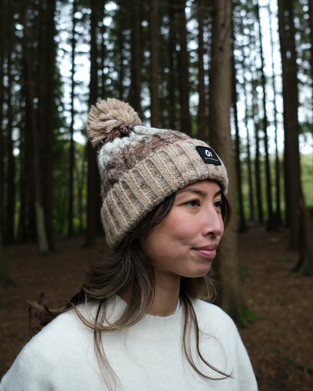 Model wearing OutsideIn Chestnut Trail Pom